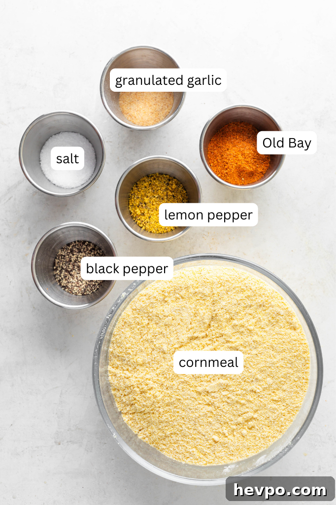 Perfect Fish Fry Seasoning Recipe for Crispy, Flavorful Fish 3 fish fry seasoning ingredients. cornmeal, lemon pepper, old bay, black pepper, kosher salt, and granulated garlic