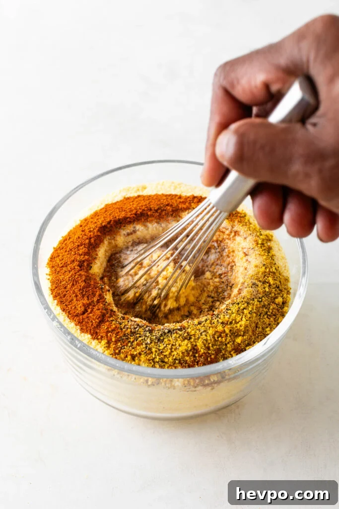 Perfect Fish Fry Seasoning Recipe for Crispy, Flavorful Fish 5 stirring fish fry seasoning