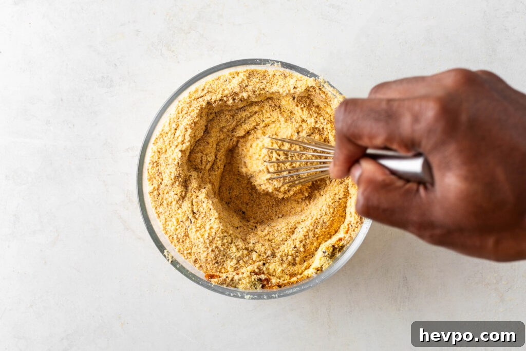 Perfect Fish Fry Seasoning Recipe for Crispy, Flavorful Fish 6 stirring fish fry seasoning