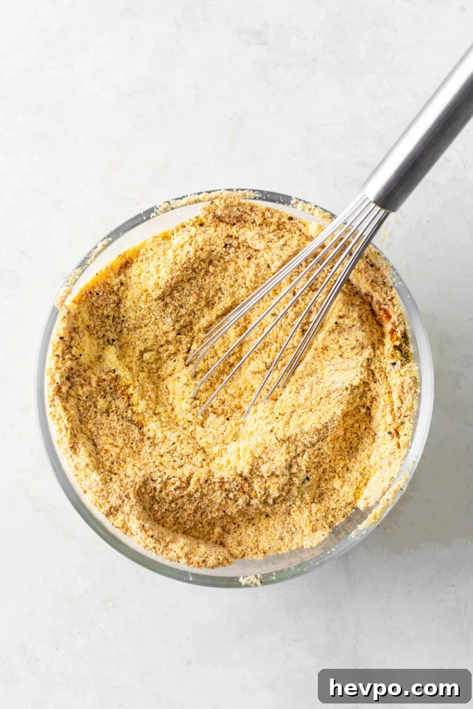 Perfect Fish Fry Seasoning Recipe for Crispy, Flavorful Fish 7 fish fry seasoning in a bowl with a whisk