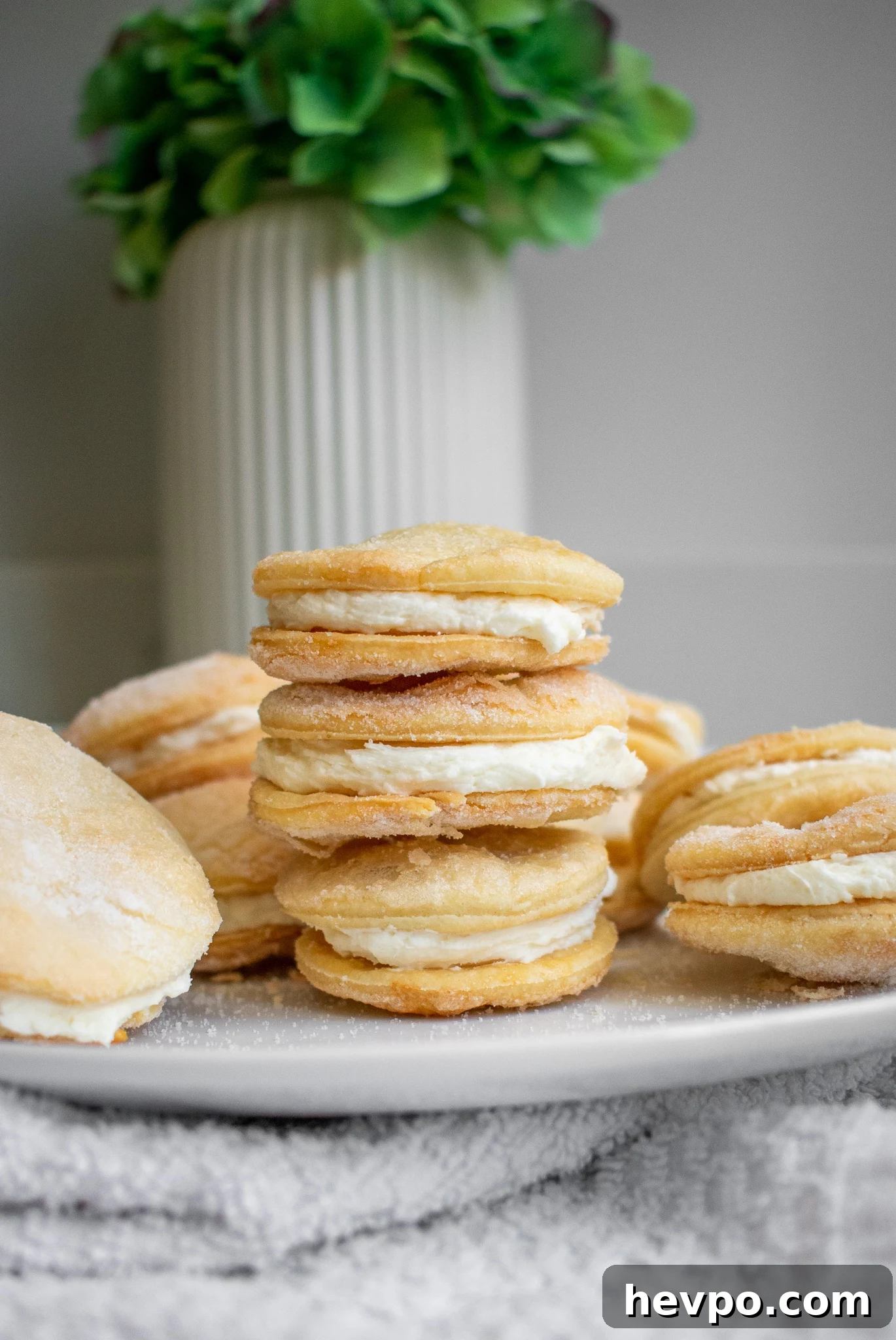 French Waffle Cookies Recipe — Crisp, Buttery Homemade Wafers 3 Sugar sandwich cookies on a plate