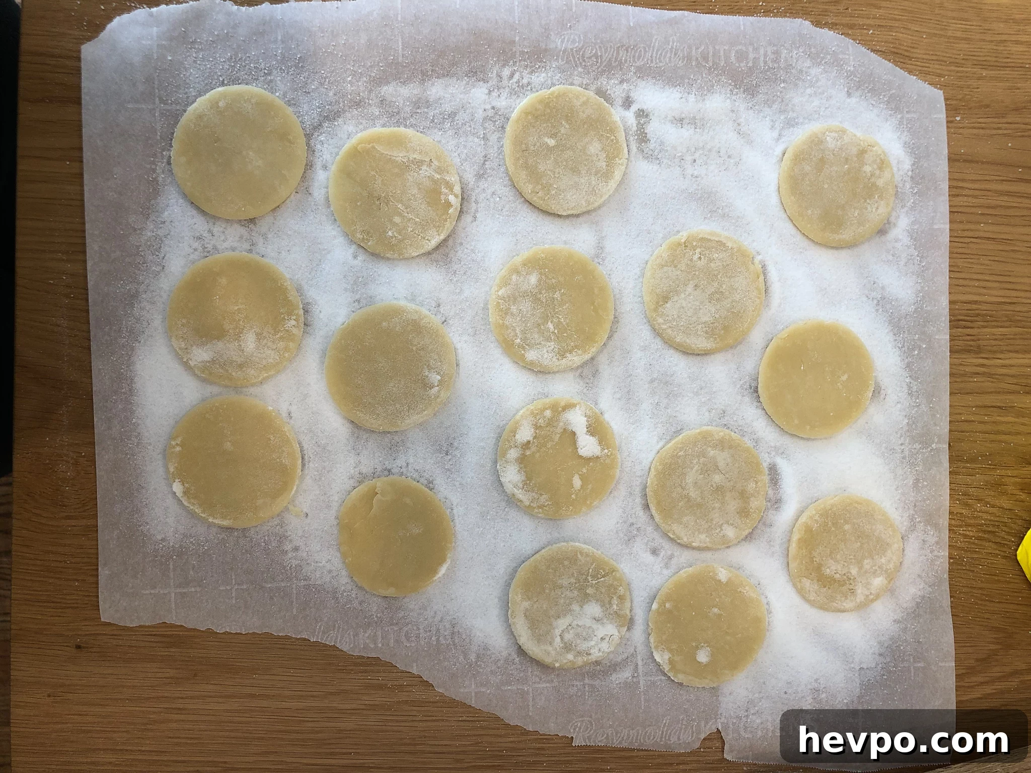 French Waffle Cookies Recipe — Crisp, Buttery Homemade Wafers 9 Cookies on a piece of parchment paper covered in sugar