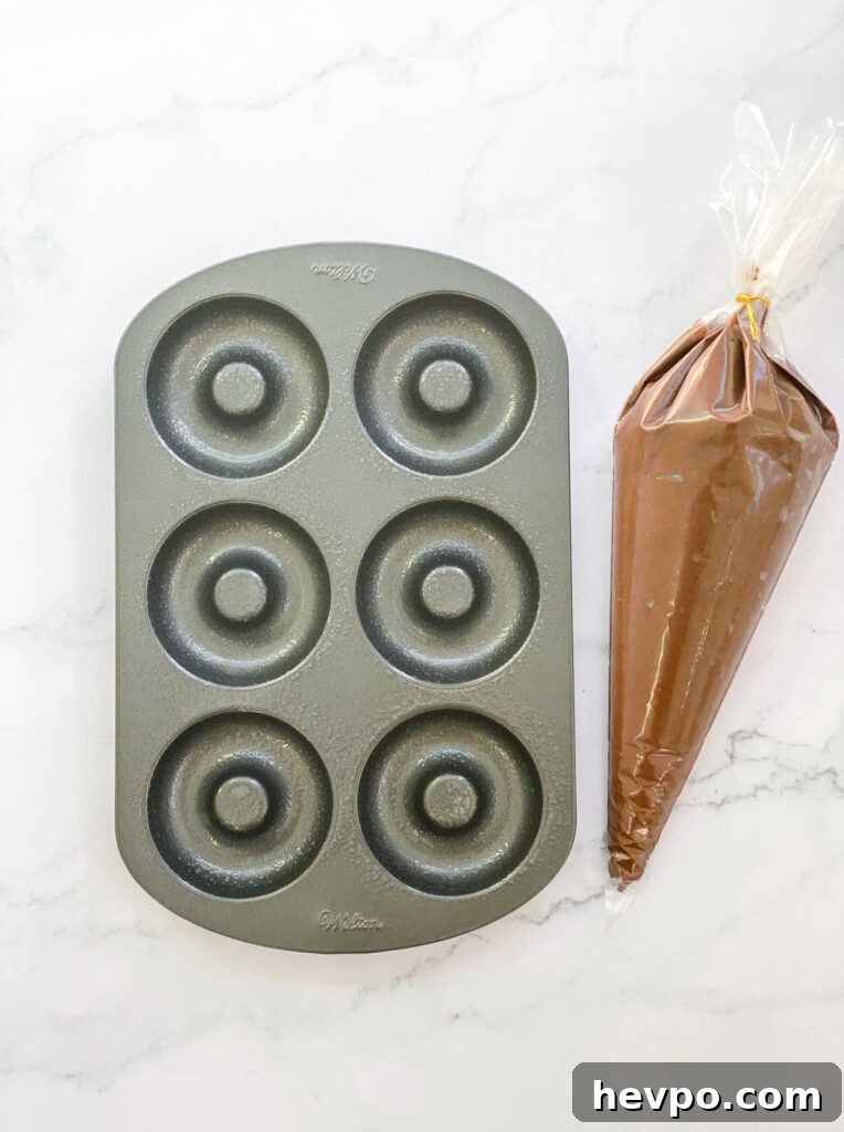 Baked Chocolate Peppermint Donuts Recipe for the Holidays 10 batter in piping bag