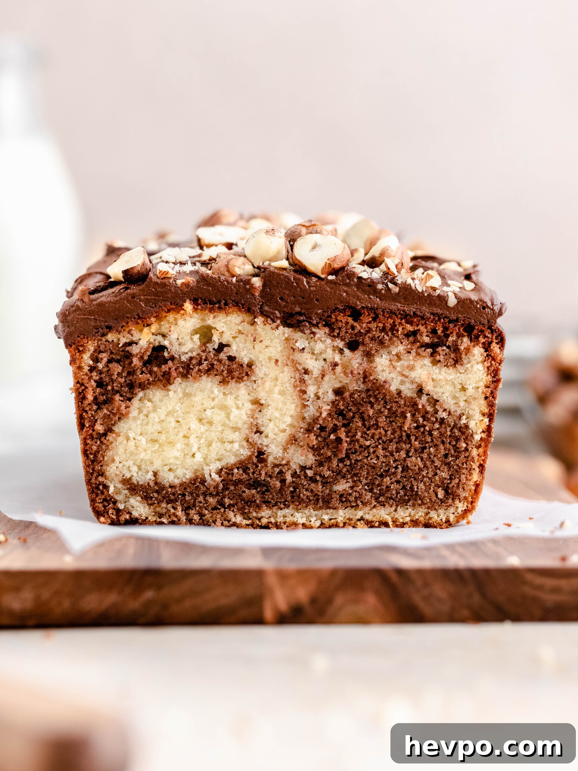 Decadent Nutella Swirl Loaf Cake Recipe for Chocolate Lovers 2 Nutella loaf cake on a tray.