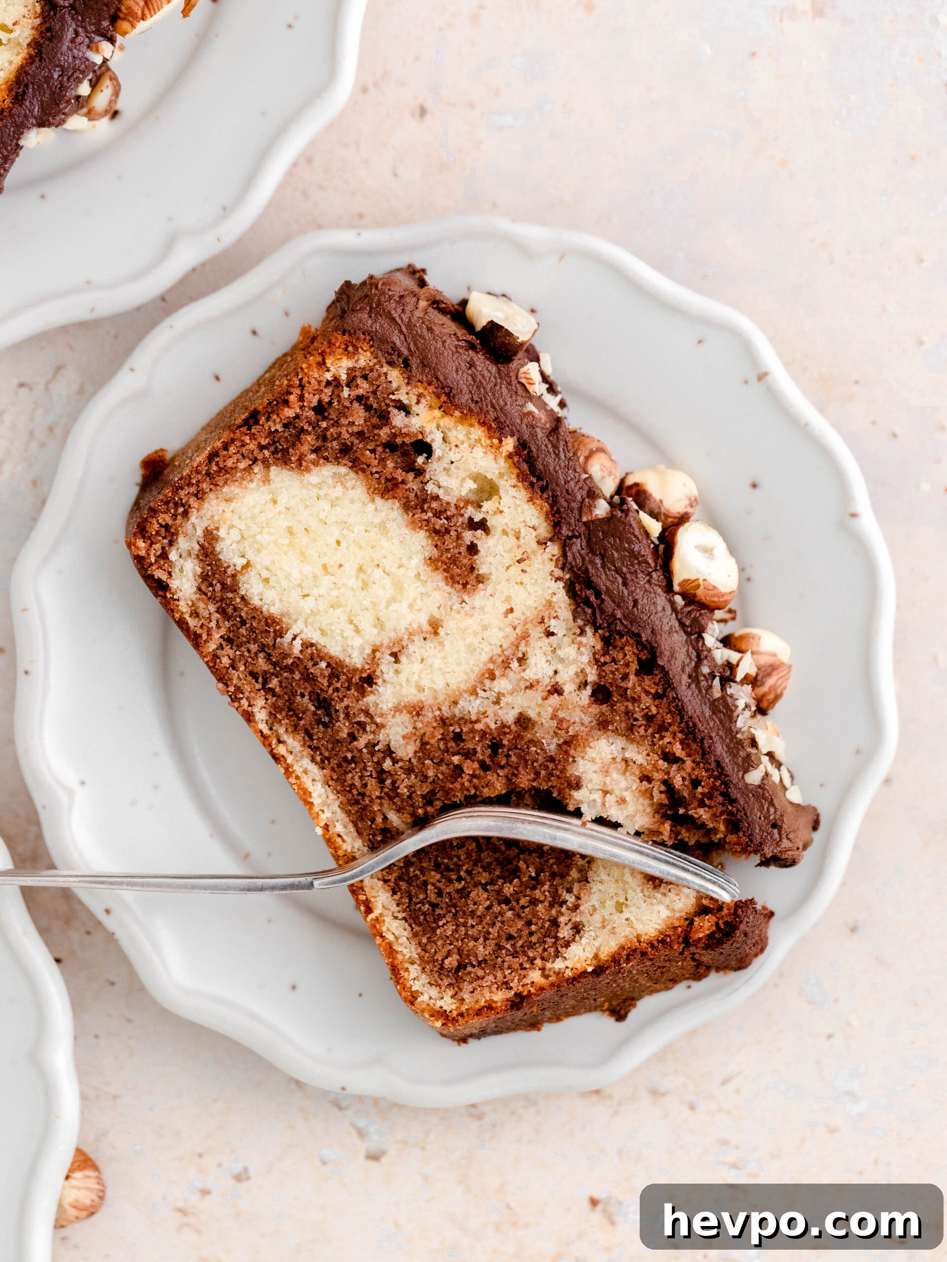 Decadent Nutella Swirl Loaf Cake Recipe for Chocolate Lovers 3 A slice of Nutella loaf cake on a plate.