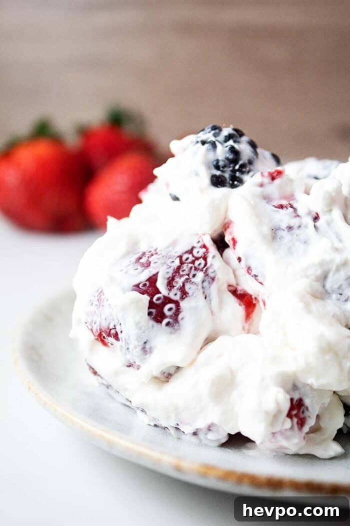 sideview of healthy keto cheesecake fluff on a white serving dish