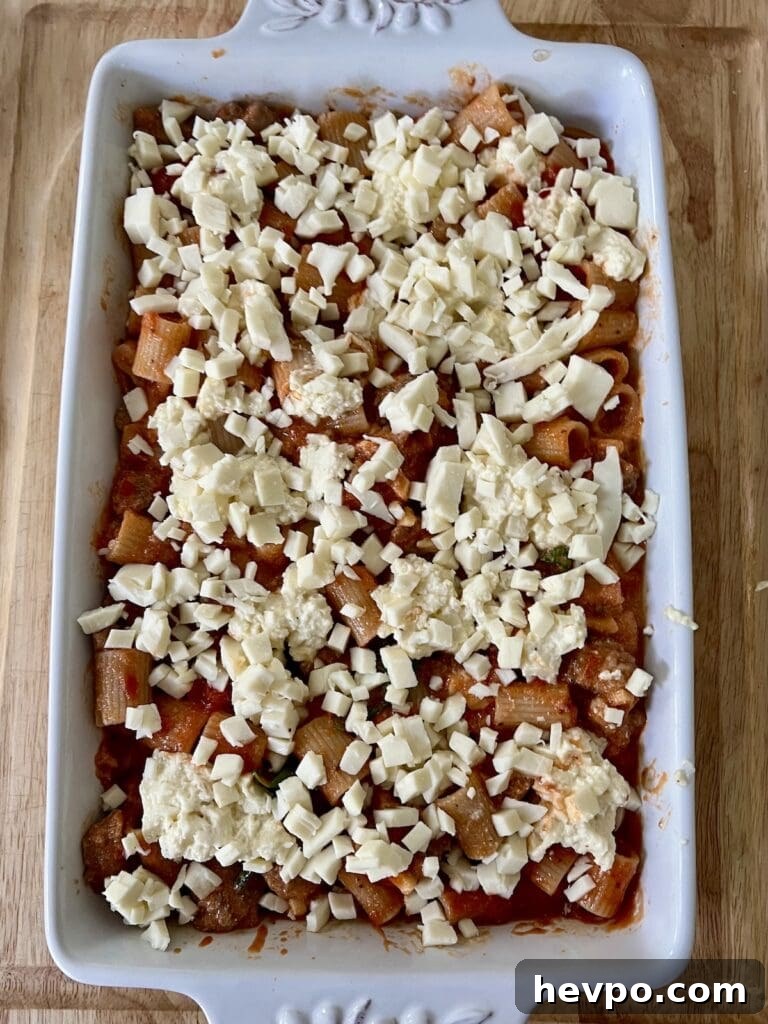 Baked Rigatoni al Forno with Sausage and Beef: Rustic Oven Pasta 15 Almost ready for the oven! Rigatoni al forno in baking dish.