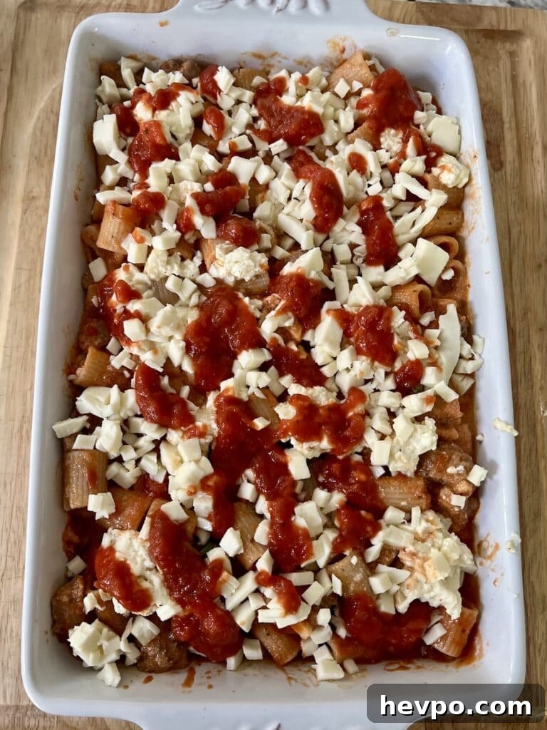Baked Rigatoni al Forno with Sausage and Beef: Rustic Oven Pasta 16 Ready for oven. Pasta al forno topped with tomato sauce and ready for oven.