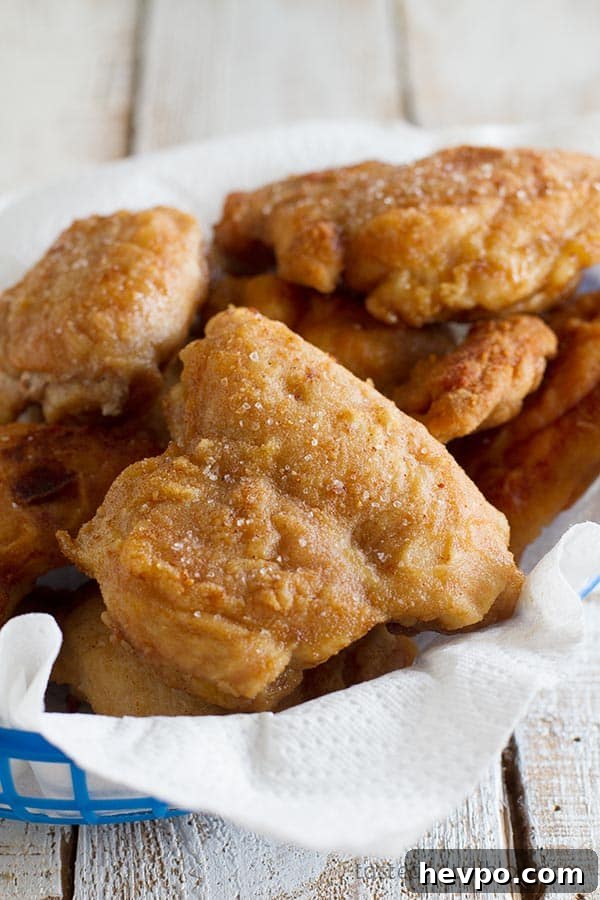 Chicken thighs are coated in a thin powdered peanut butter and flour coating in this Georgia Peanut Fried Chicken that is not your typical fried chicken recipe!