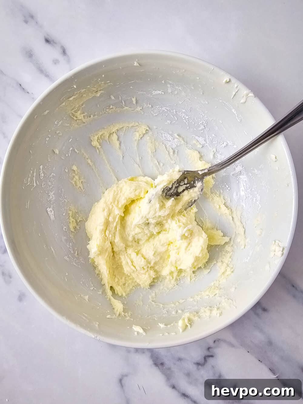 mixed cream cheese and sweetener in a bowl