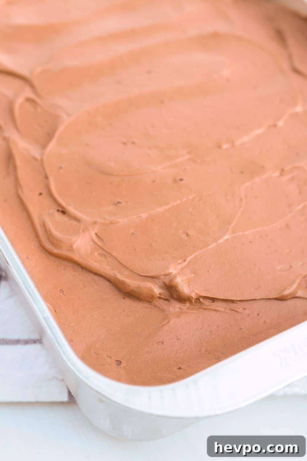 close-up view of chocolate Dream Whip frosting spread over a Dream Whip cake