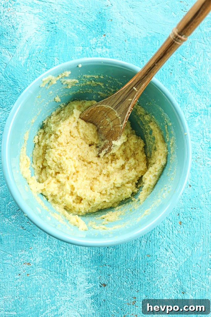 Keto Gluten-Free Sugar-Free Lemon Loaf Cake Recipe 6 Lemon Loaf Cake ingredients mixed together in a bowl