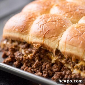 Hawaiian Roll Cheeseburger Sliders Recipe for Game Day 9 cheeseburger sliders on a baking sheet