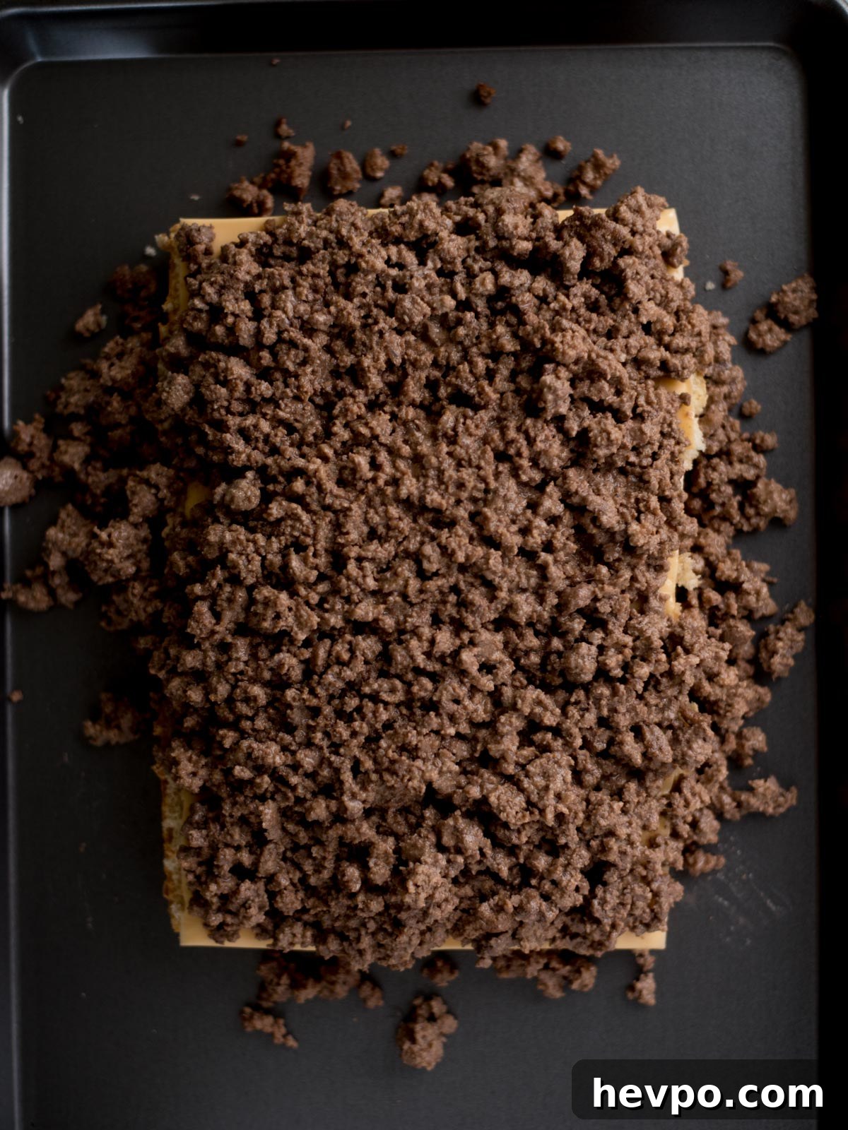 Hawaiian Roll Cheeseburger Sliders Recipe for Game Day 5 ground beef mixture on top of the bottom part of the buns with cheese