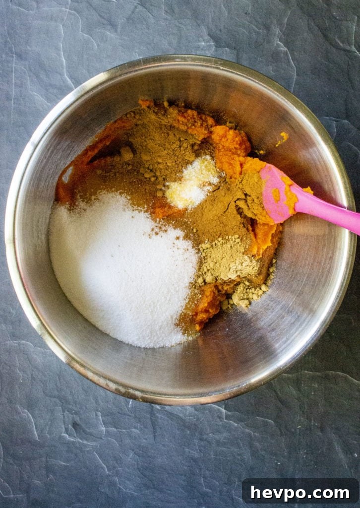 pumpkin crunch cake ingredients in a mixing bowl