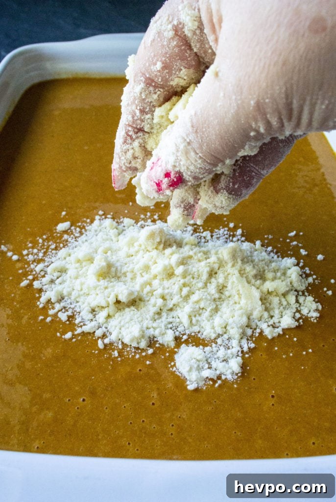 crumbly cake mix topping on pumpkin crunch cake