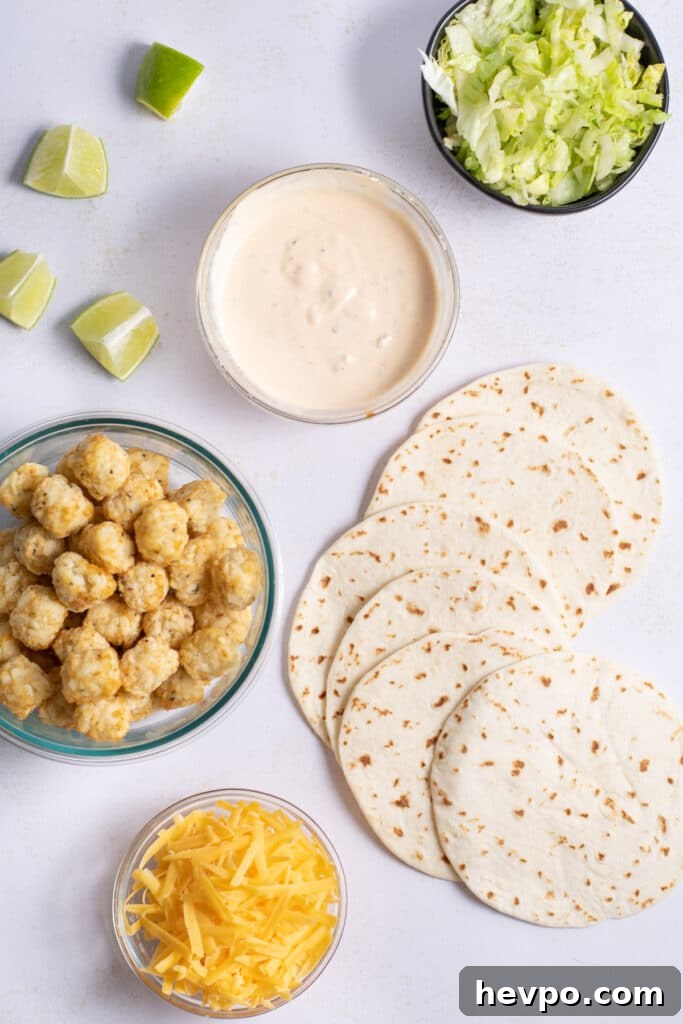 Spicy Potato Soft Tacos Recipe for Flavorful Weeknight Meals 4 Ingredients for a spicy potato soft taco recipe: tator tots, tortillas, cheddar cheese, ice berg lettuce, lime wedges and creamy spicy sauce