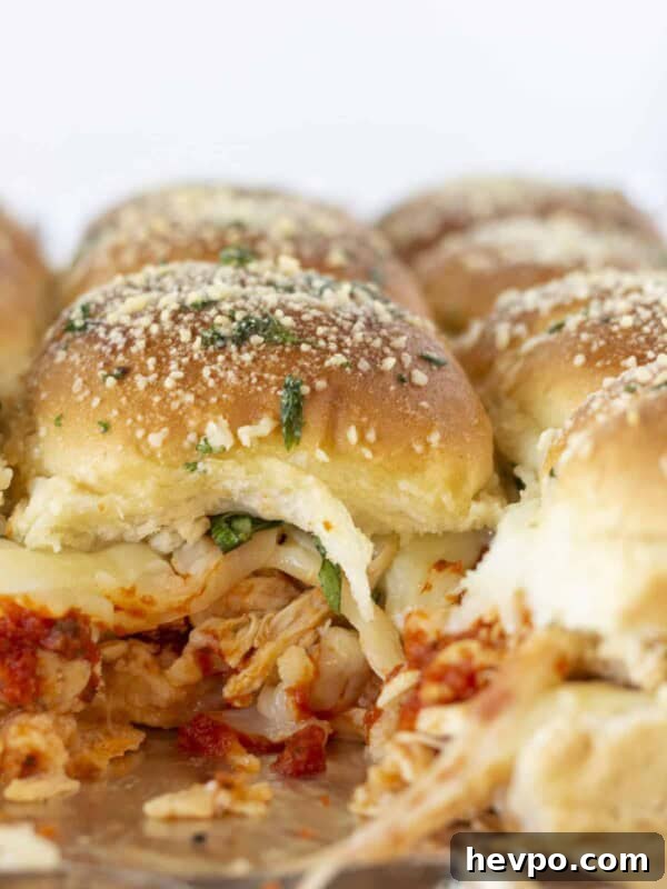 Looking at the inside of baked Chicken Parmesan Sliders.