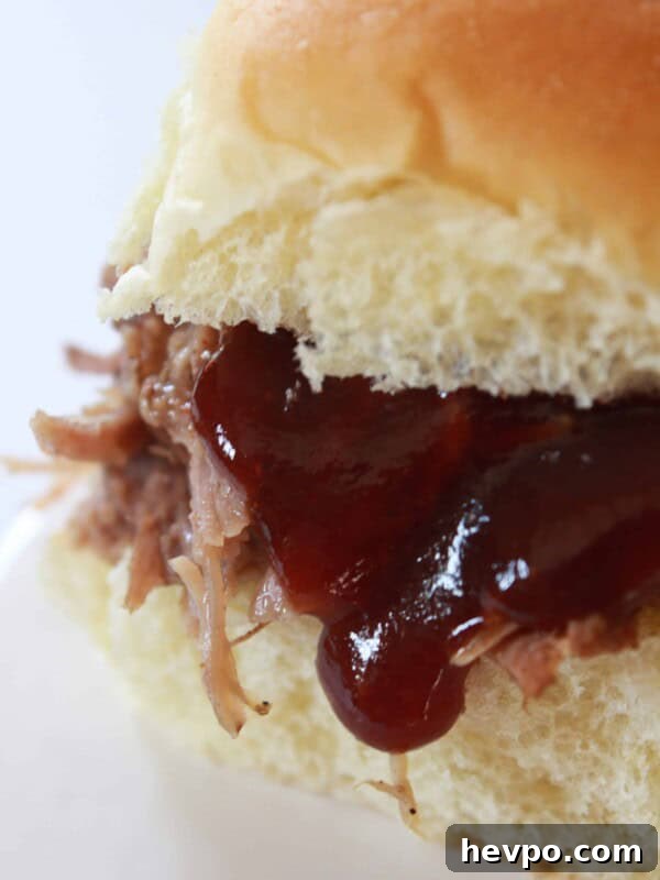 Crock Pot Pulled Pork Recipe featured by top US food blog, Practically Homemade