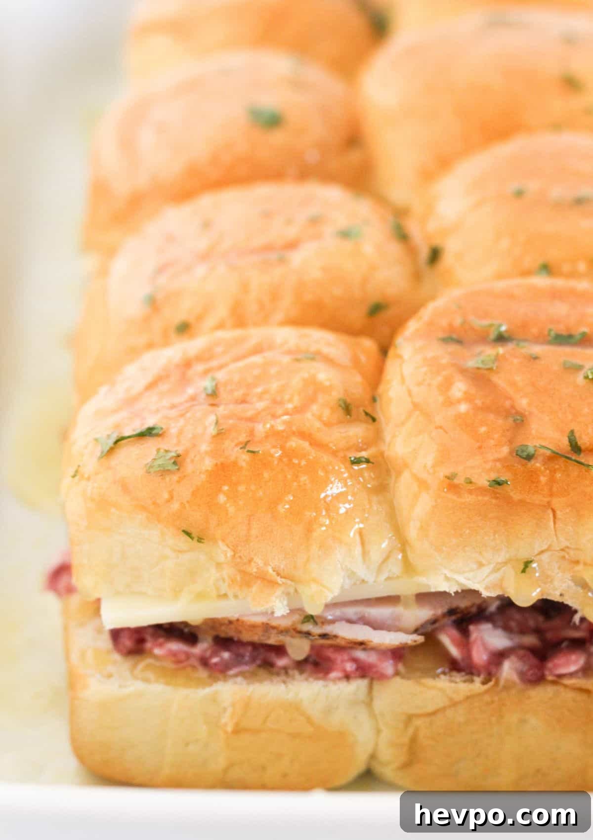 Turkey Cranberry Sliders with Herbed Cream Cheese Recipe 8 Topping with rolls and butter mixture for baking.
