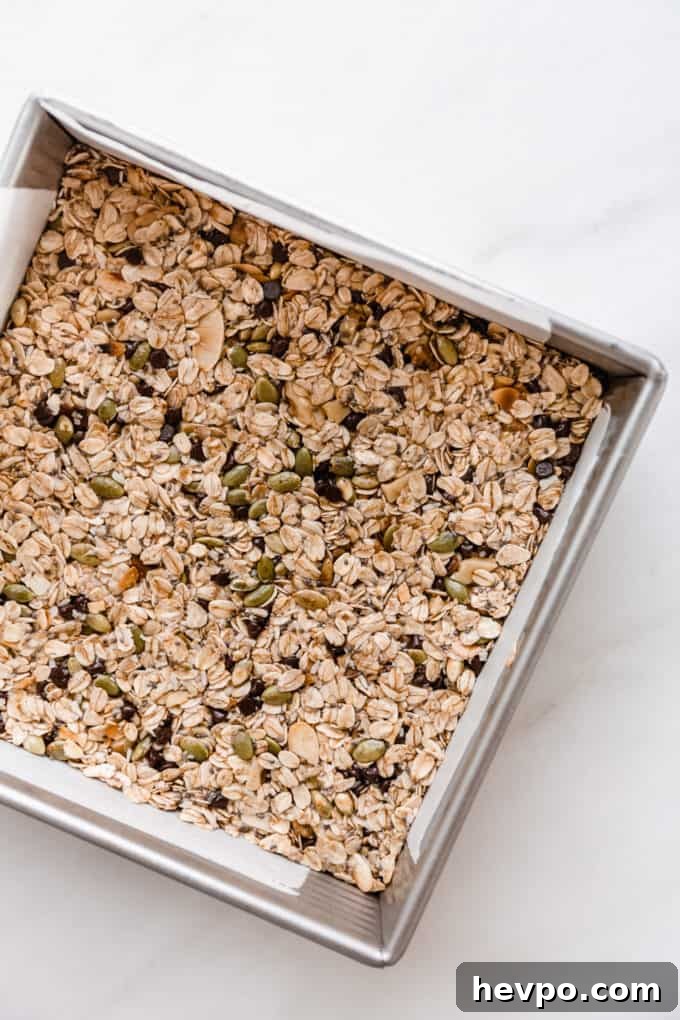 Homemade Muesli Bars Recipe for Energy and Crunch 7 unbaked muesli bars in a square pan