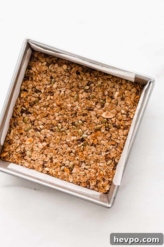 Homemade Muesli Bars Recipe for Energy and Crunch 8 baked muesli bars in a square pan