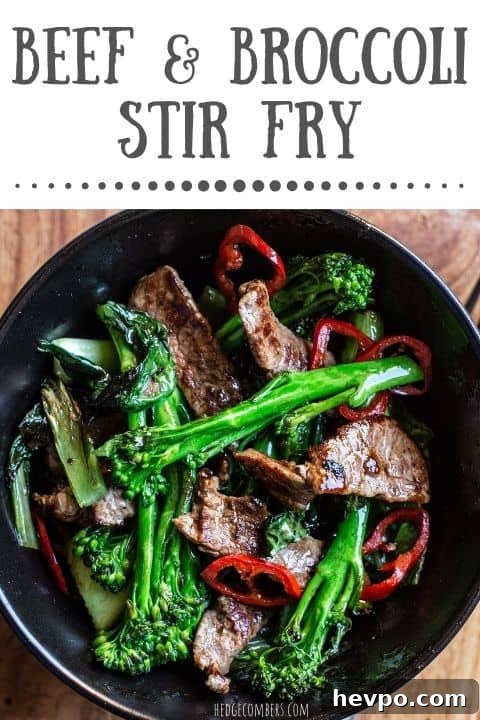 black bowl with bright green broccolini charred sirloin steak strips and rings of red chilli
