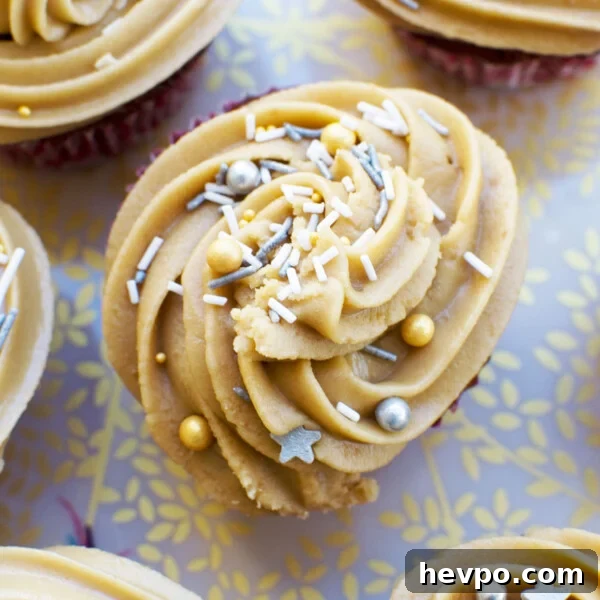Melomakarona: Traditional Greek Christmas Honey Cookies Recipe 7 A top view of some gingerbread muffins with salted caramel icing on a decorative plate