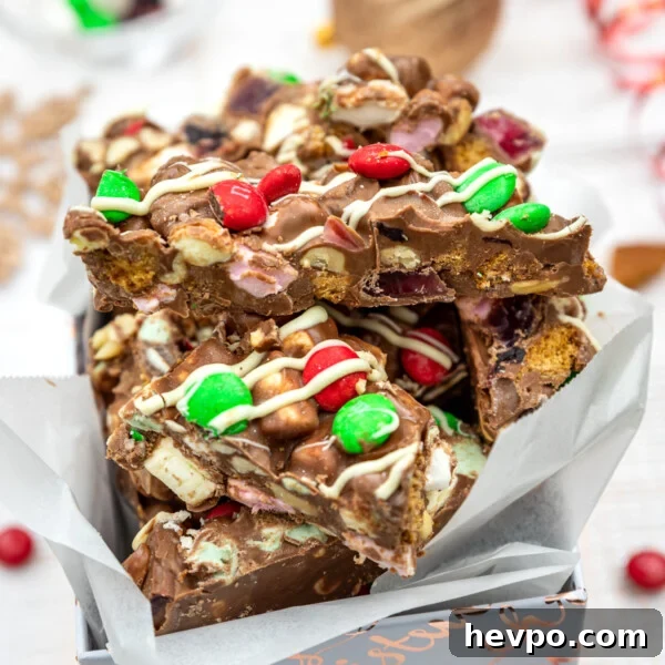 Melomakarona: Traditional Greek Christmas Honey Cookies Recipe 8 Christmas rocky road in a white and gold box with Christmas decorations behind