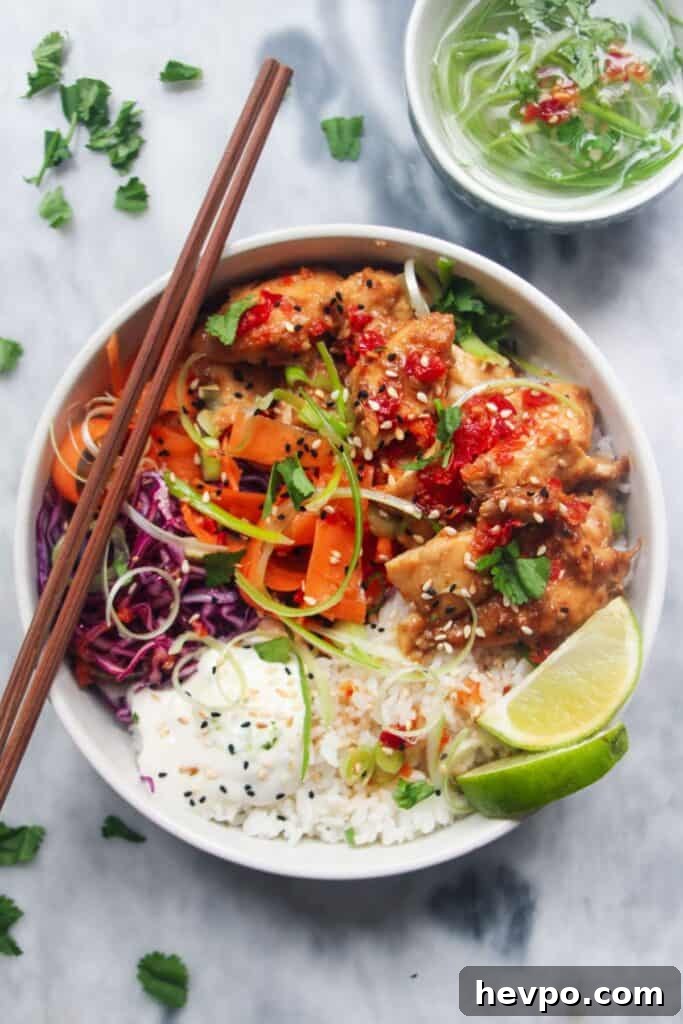 Crispy Korean Fried Chicken Recipe: Extra Crunch & Sticky Sauce 14 Grilled chicken poke bowl on a grey marble background.