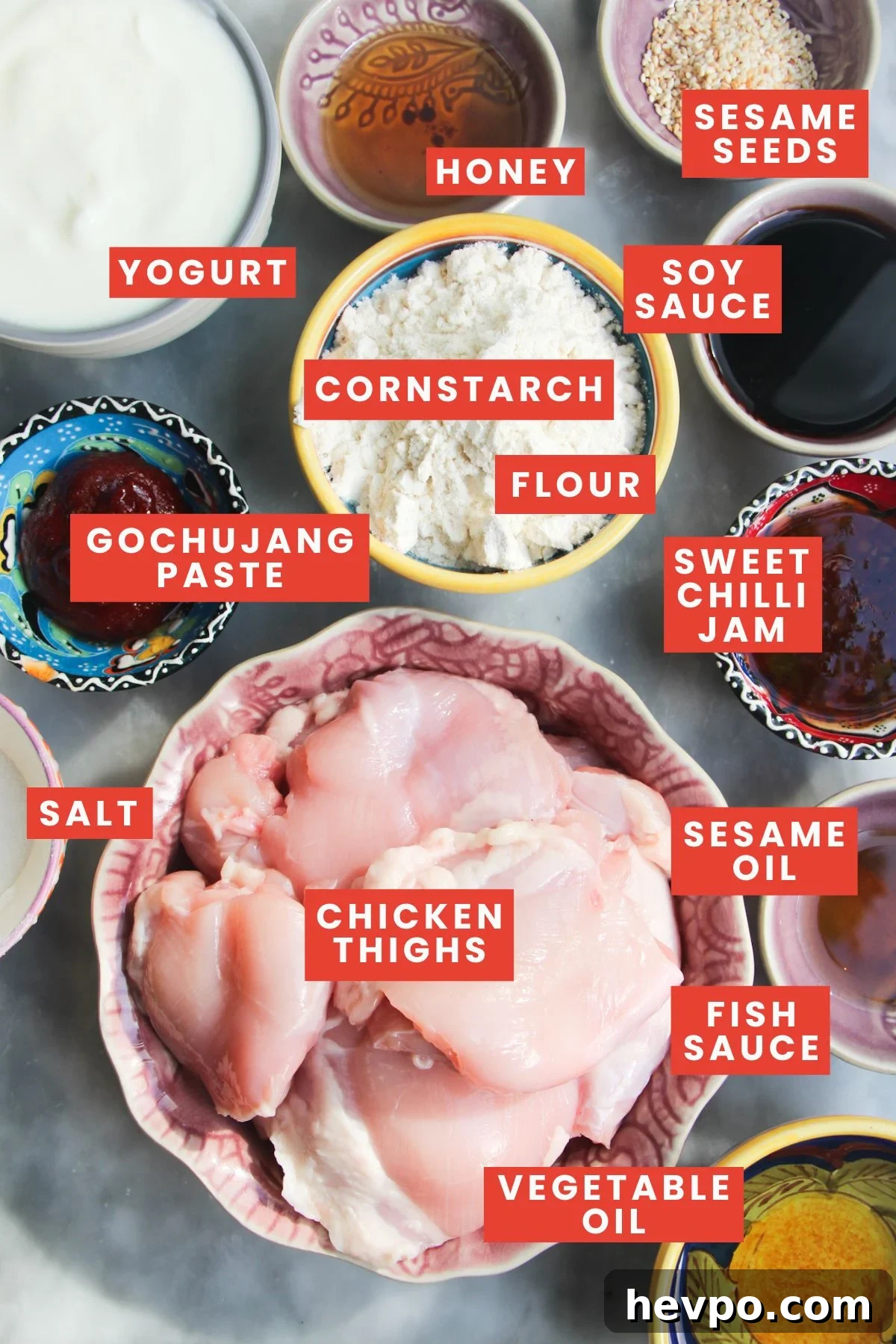 Crispy Korean Fried Chicken Recipe: Extra Crunch & Sticky Sauce 3 Ingredients for Korean fried chicken, labelled and laid out on a marble background.