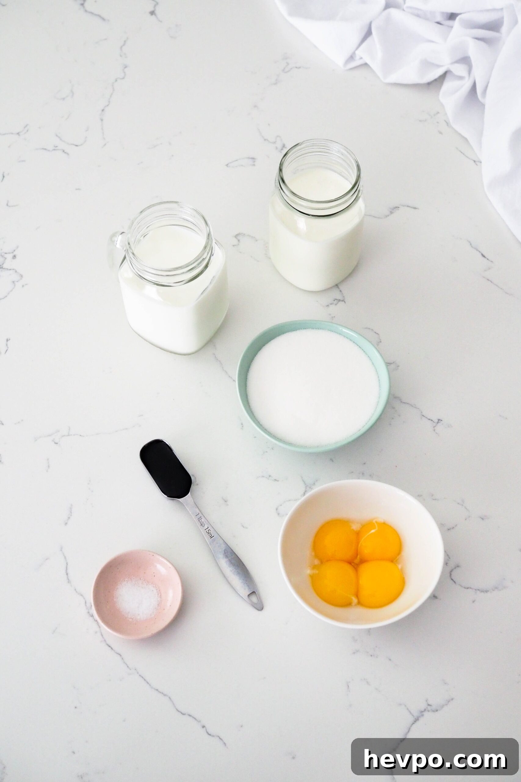 Homemade French Vanilla Ice Cream Recipe – Creamy & Classic 3 Ingredients for French vanilla ice cream on a white counter.