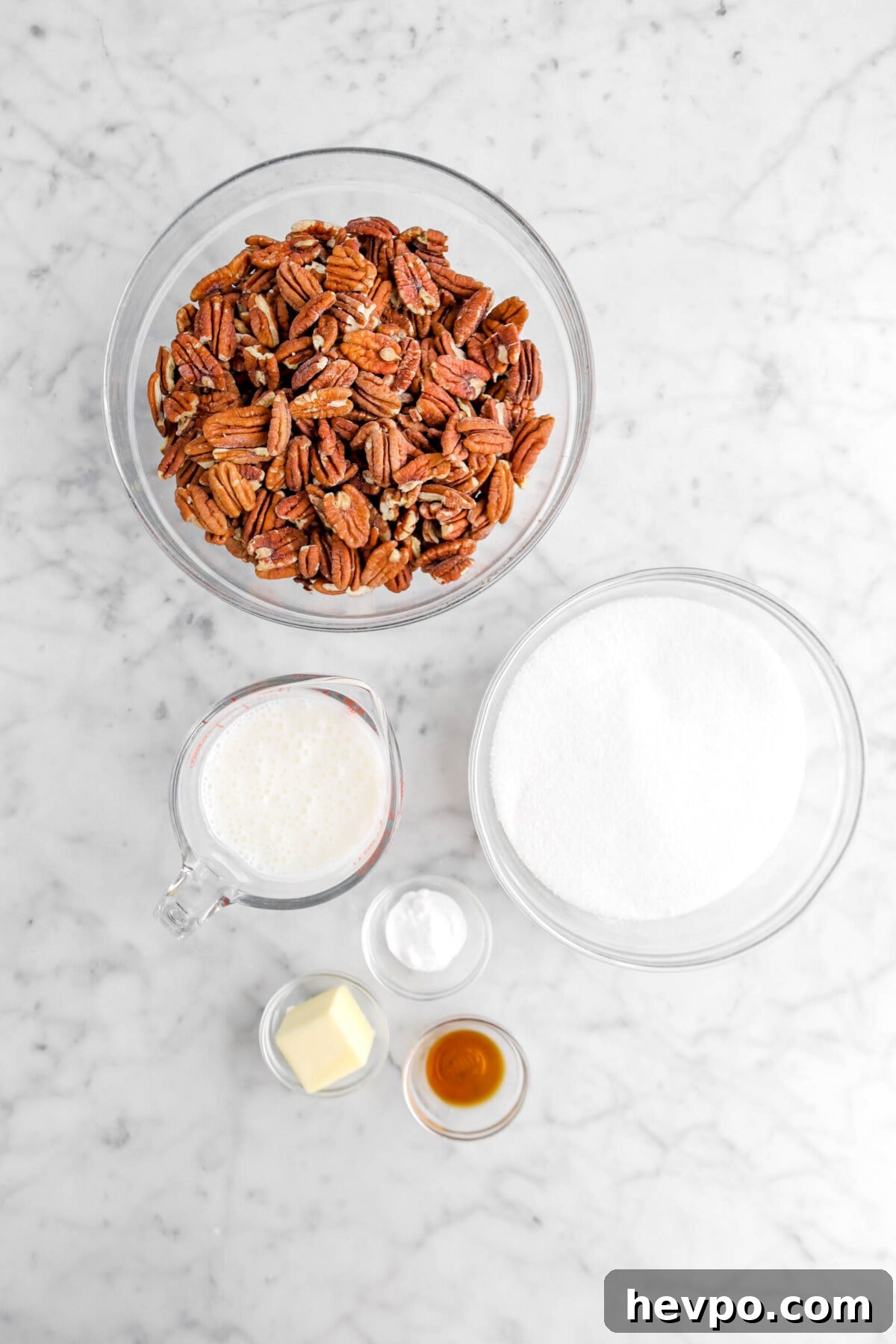 Southern Buttermilk Pecan Pralines Recipe – Classic Southern Candy 7 pecan halves, buttermilk, sugar, baking soda, butter, and vanilla on marble surface
