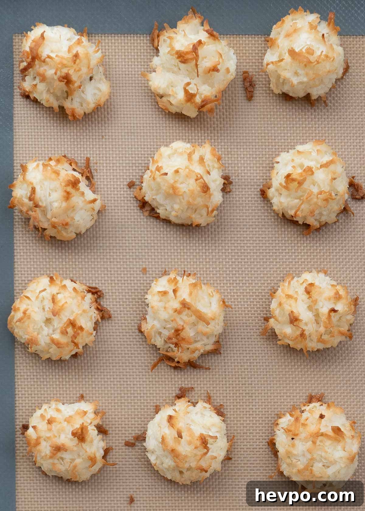 overhead shot of cooked macaroons on baking sheet