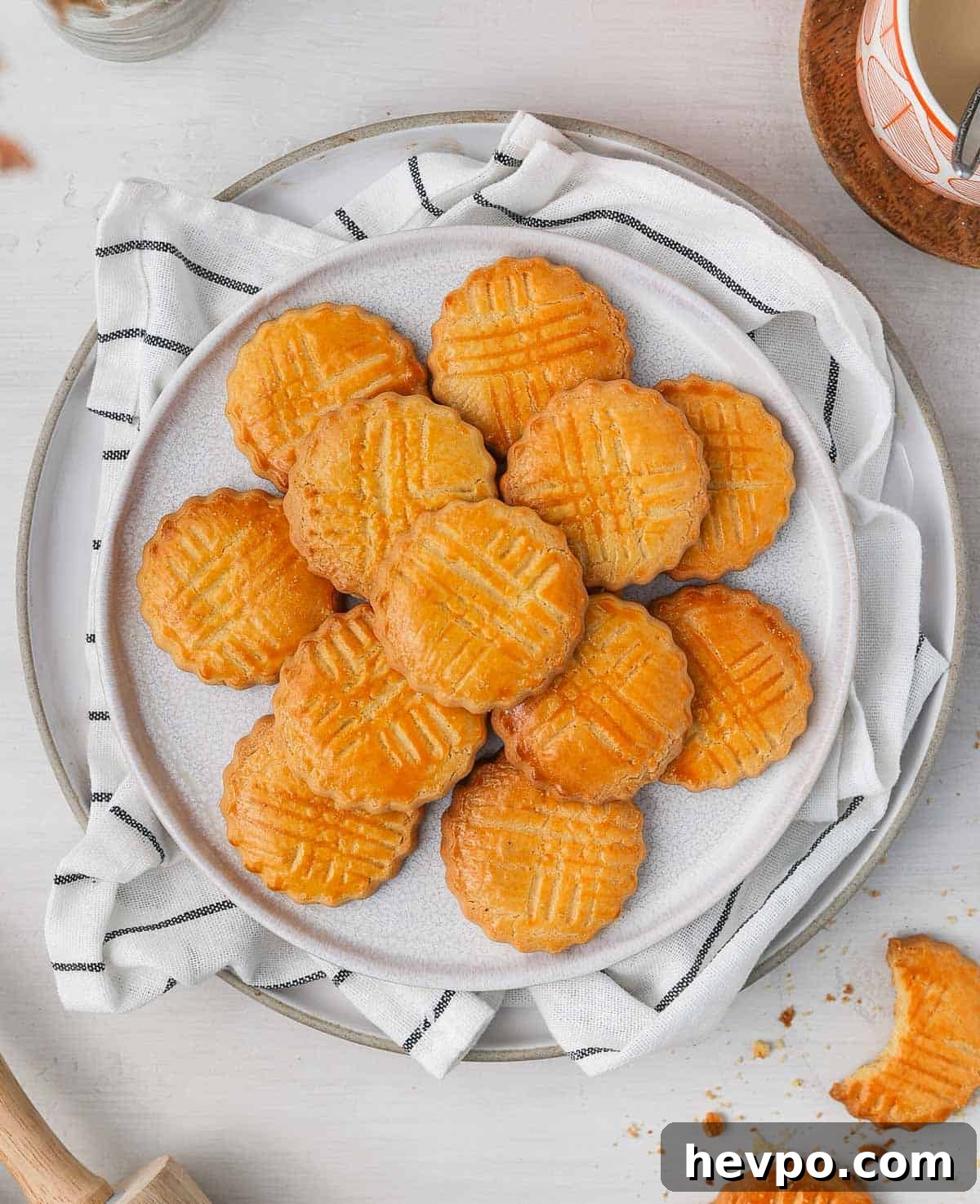 Classic French Sablés Bretons: Irresistible Salted Butter Cookies 3 Sables cookies on a white plate seen from above.
