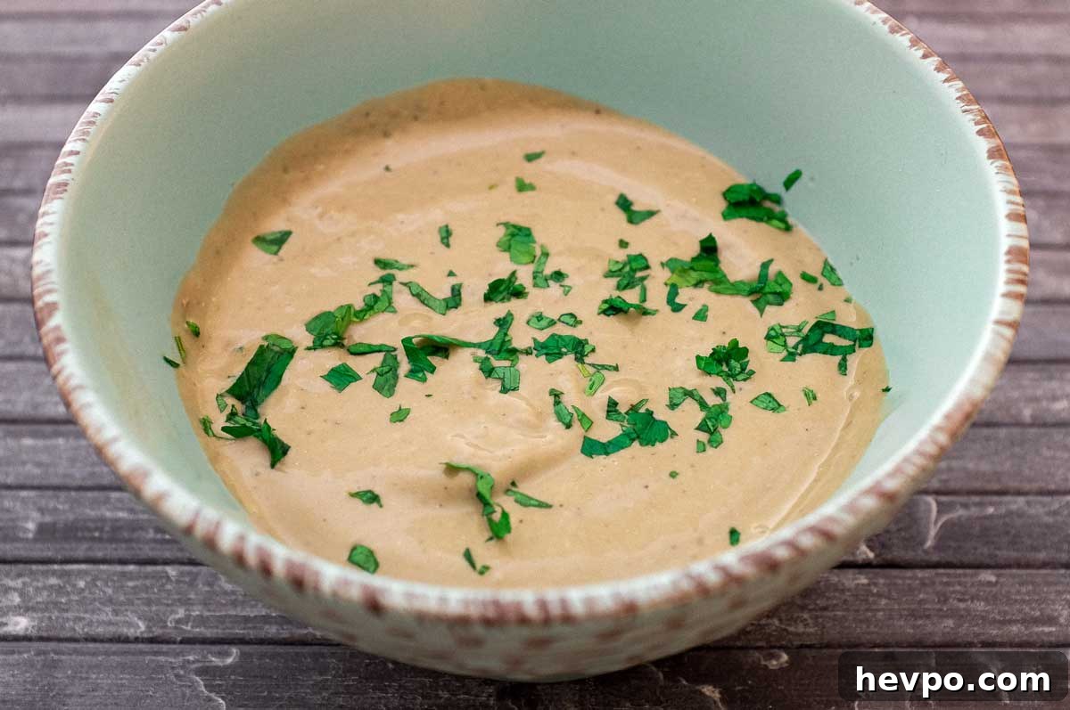 Top 10 Most Popular Recipes of 2022 You Need to Try 11 A bowl of Anchovy Sauce, scattered with fresh parsley.