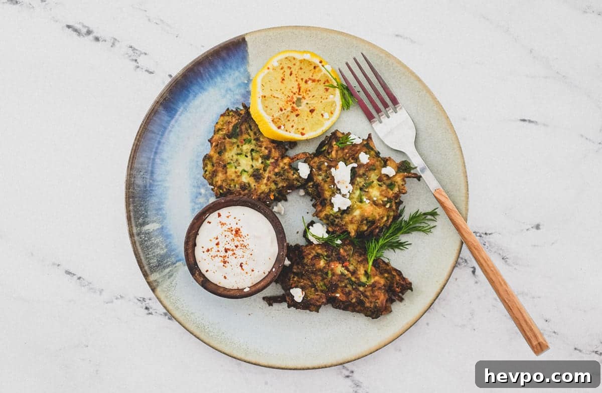Top 10 Most Popular Recipes of 2022 You Need to Try 7 A platter of zucchini fritters with feta cheese and lemon slices