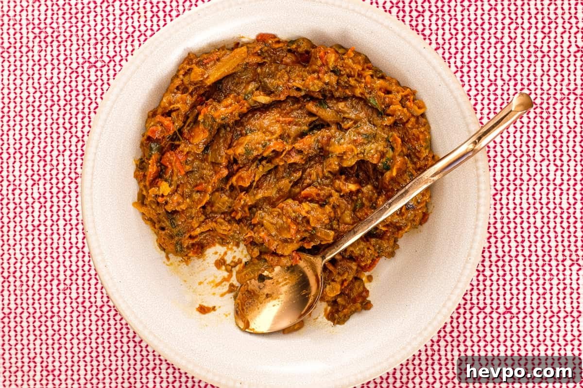 Top 10 Most Popular Recipes of 2022 You Need to Try 9 Zaalouk, a Moroccan dip or salad on a platter with a spoon