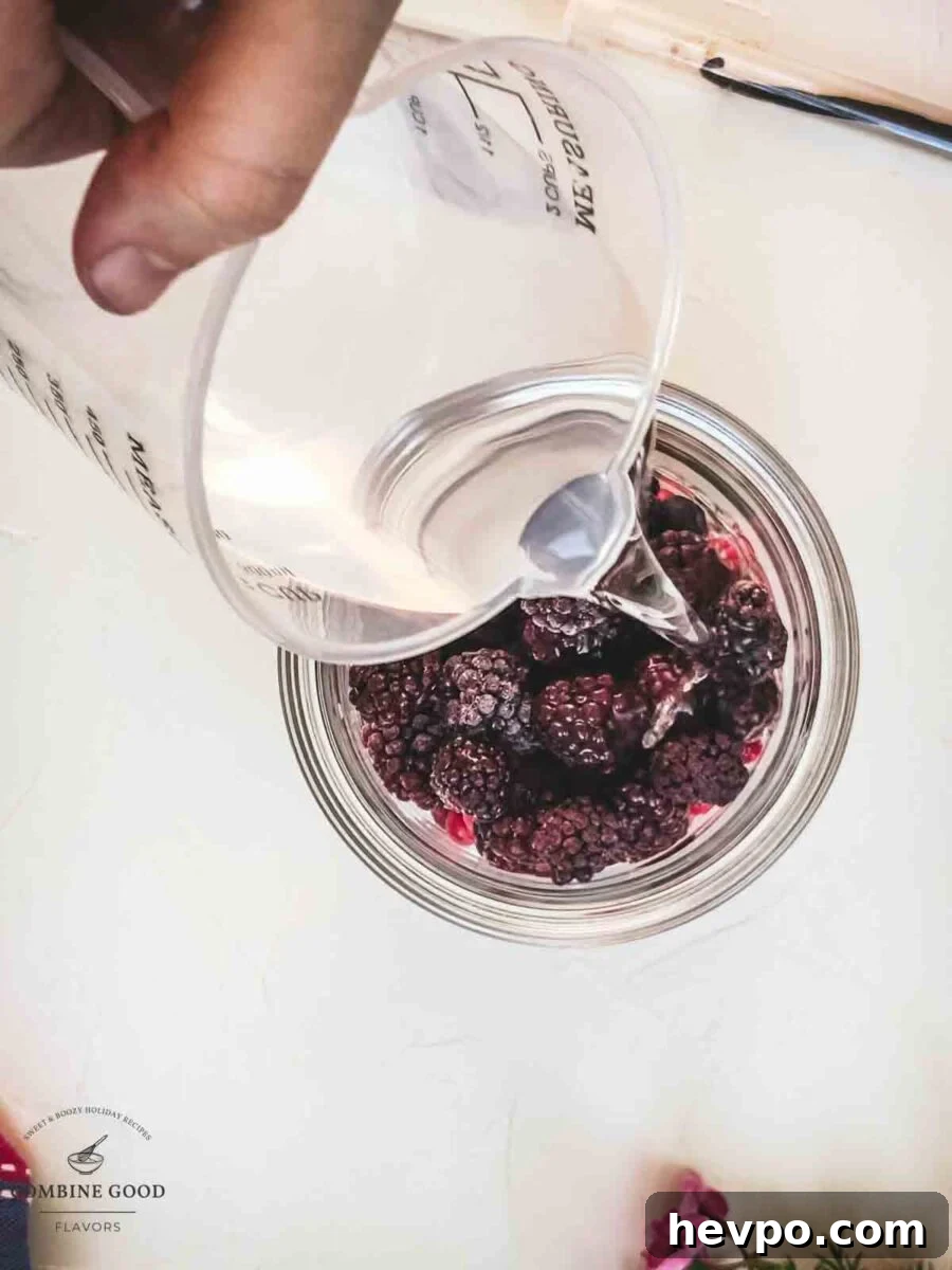 Pour vodka to the berry mix.