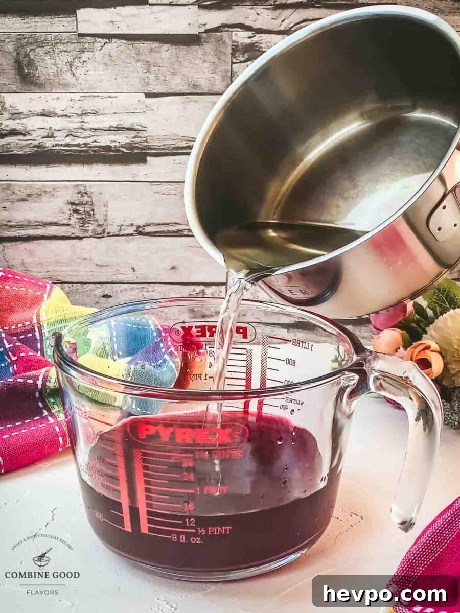Pour the simple syrup into the jug with the berry infused vodka.