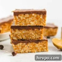 Healthier scotcheroo bars stacked 3 high.