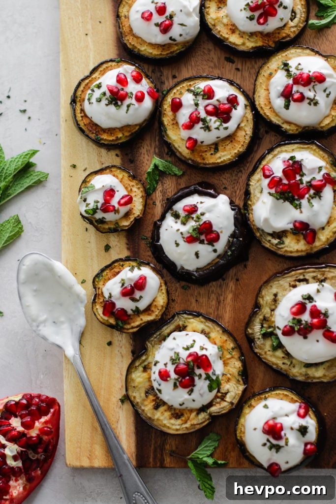 Eggplant rounds with herbed yogurt sauce and pomegranate