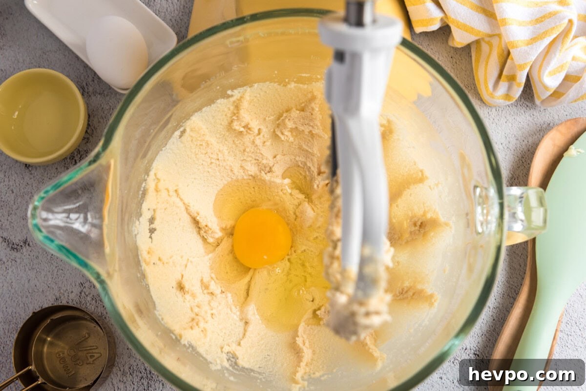 adding eggs to butter mixture