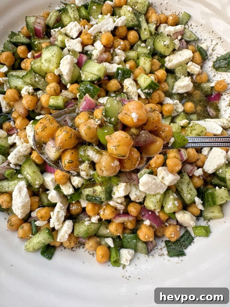 A spoon of Chilled Greek Bean Salad