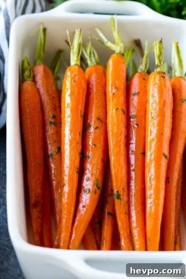 Cajun-Roasted Turkey Recipe for Bold, Spicy Flavor 7 Honey roasted carrots in a baking dish, garnished with chopped parsley.