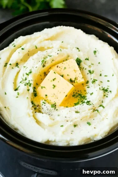 Cajun-Roasted Turkey Recipe for Bold, Spicy Flavor 9 Crock pot mashed potatoes topped with butter and parsley.