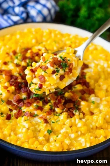 Cajun-Roasted Turkey Recipe for Bold, Spicy Flavor 10 A spoonful of creamed corn topped with bacon and fresh herbs.
