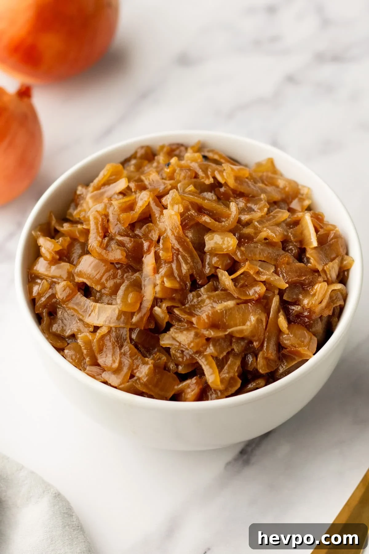 Slow Cooker Caramelized Onions Recipe for Sweet, Hands-Off Flavor 2 An image of crockpot caramelized onions in a pot.