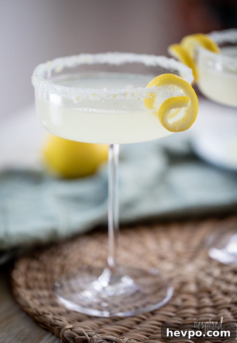 Zesty Lemon Drop Martini Recipe: How to Make the Classic Cocktail 2 Lemon Drop Martini in martini glass.