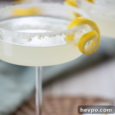 Zesty Lemon Drop Martini Recipe: How to Make the Classic Cocktail 11 Lemon Drop Martini in martini glass.